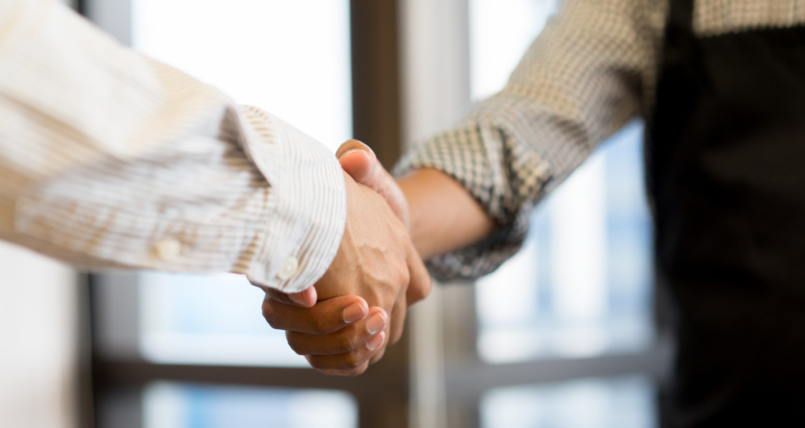 businessman-handshake-with-partner-successful